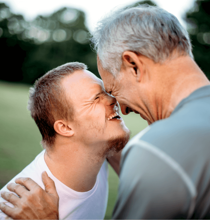 Father and son nuzzling heads